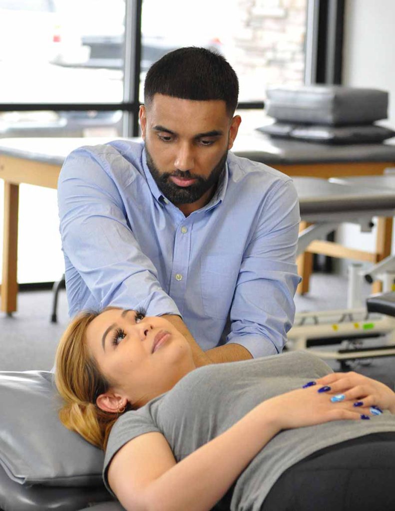 physical therapist working on a neck