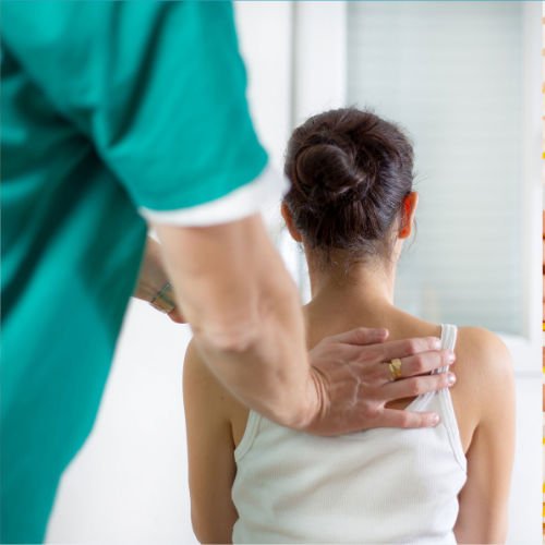 physical therapist working on the mid back