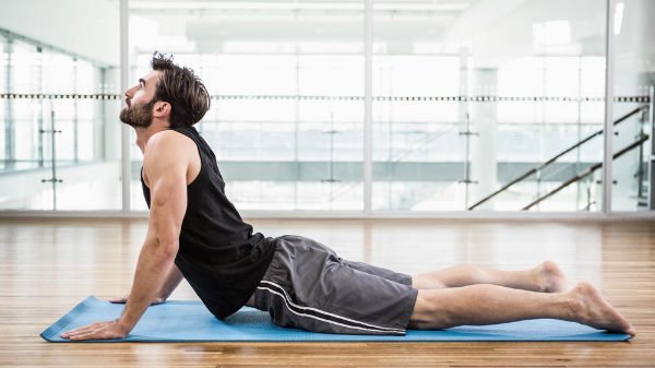 man in cobra yoga position