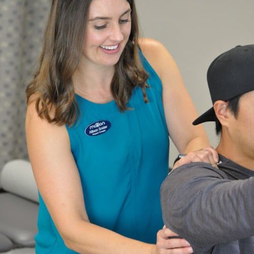 Allison Scap Physical therapist working on shoulder