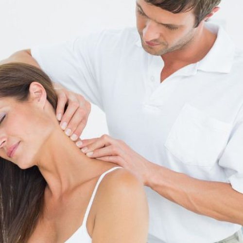 Neck Tx 1 physical therapist working on woman with neck pain