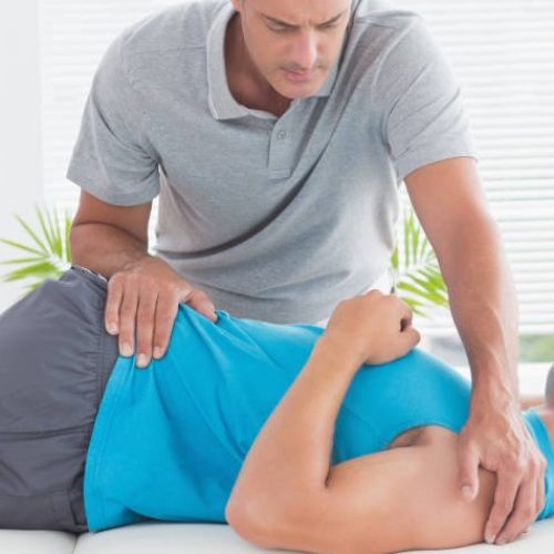 PT STOCK SMALL LONG physical therapist working on patient