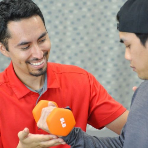 Ramon Dumbell physical therapist working with a patient